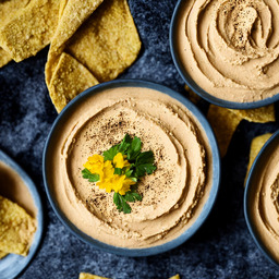 A photograph of a plate of Hummus, generated by AI