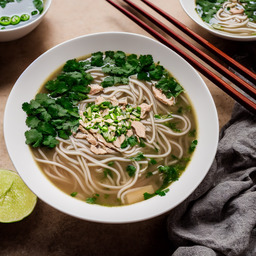 A photograph of a plate of Pho Noodle Soup, generated by AI