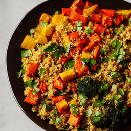 A photograph of a plate of Roasted Vegetable Quinoa Bowl, generated by AI