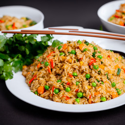 A photograph of a plate of Thai Fried Rice, generated by AI